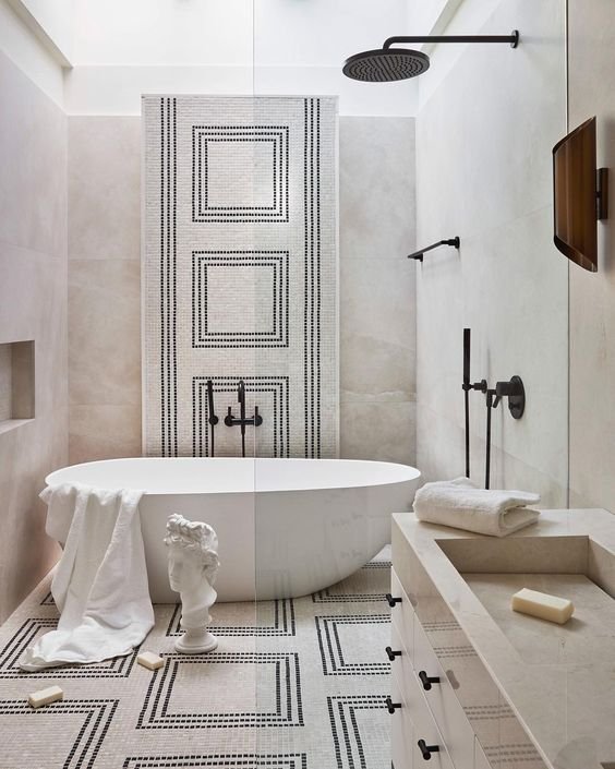 classic modern bathroom with freestanding tub and mosaic tile