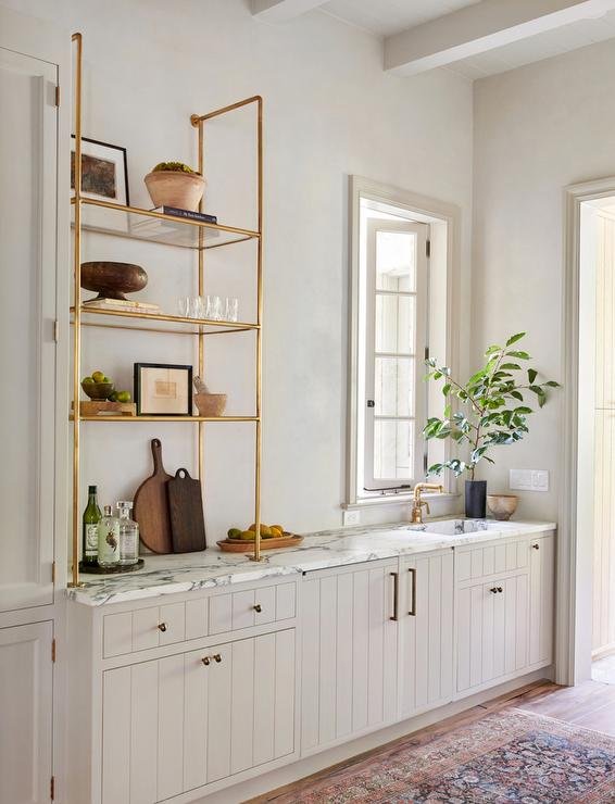 rustic modern kitchen cabinets by Amber Lewis with beautiful brass shelves